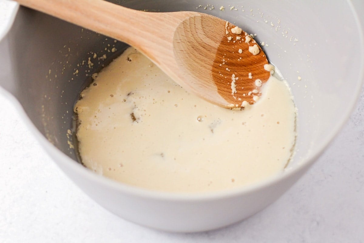 Our famous homemade Naan bread is soft and chewy with the perfect hint of garlic. It's an easy side - perfect for pairing with any meal. Yeast and sugar in bowl with water.